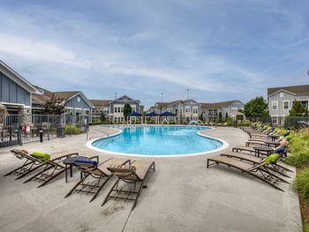 Resort-style swimming pool with cabanas